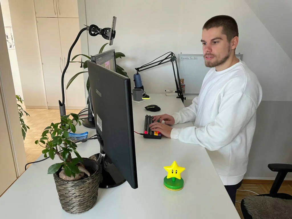 Man working at home office desk with computer