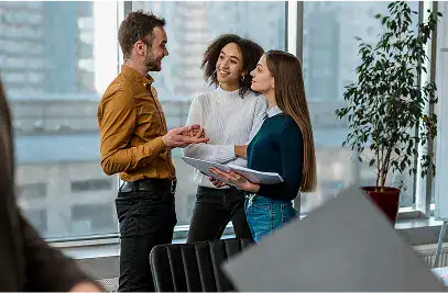 Three professionals discussing over documents in office