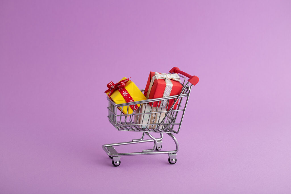 Shopping cart with colorful wrapped gifts